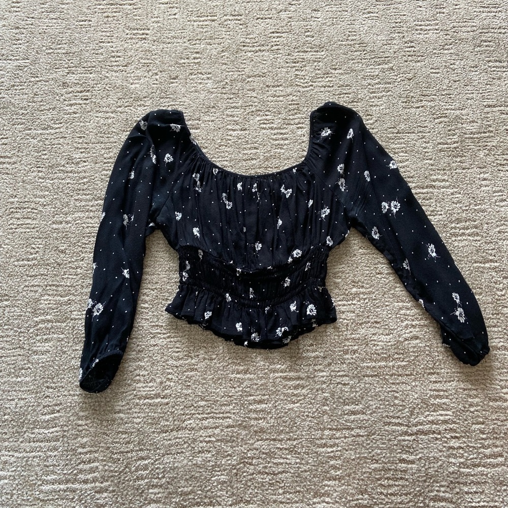 Black crop top with white flowers from tillys.